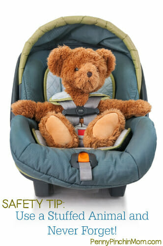 Teddy bear sitting on baby seat ready to get a safe trip
