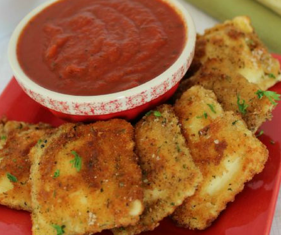 toasted ravioli on red plate with sauce