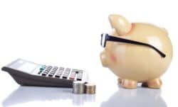 Piggy bank and calculator for budgeting