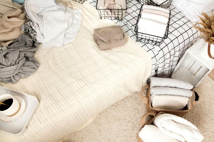 Folded blankets and basket storage