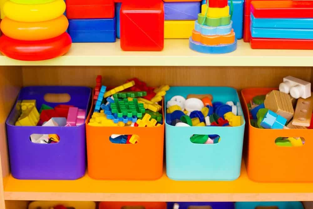 Colored boxes with children's toys on the shelves