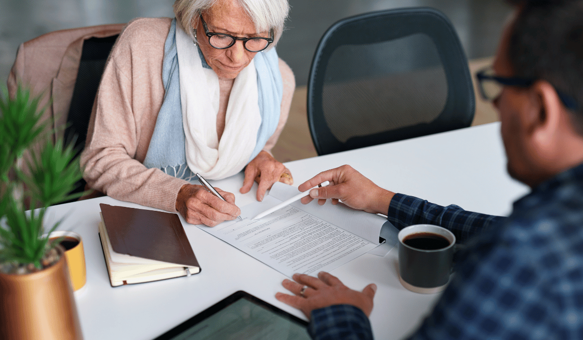 woman signing doc